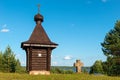 A small chapel and an old cross on a hilltop Royalty Free Stock Photo