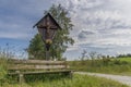 Wayside Cross And Wooden Bench In The Bavarian Forest In GrÃÂ¼b By Grafenau