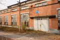 Wayside deserted 1970s` red brick workshop of boiler factory in sunny winter