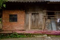 Wayside dilapidated old building in cloudy morning