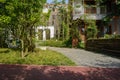 Wayside storied apartment with fenced yard in sunny summer