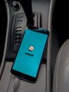 Waze app on smartphone screen on the car Royalty Free Stock Photo