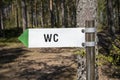 Wc toilet sign in forest