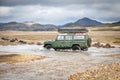 4WD car wades river in Iceland Royalty Free Stock Photo