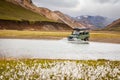 4WD car wades river in Iceland Royalty Free Stock Photo