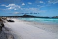 4WD cars parked on white sandy beach at Lucky Bay, Western Australia