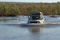 4WD driving through a river