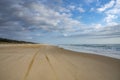 Four wheel driving on Beach and tire Tracks Fraser Island Great Sandy National Park, Queensland Australia. Royalty Free Stock Photo