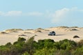 4WD vehicle driving on sand dune near Kalbarri Western Australia Royalty Free Stock Photo