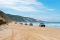 4wd vehicles at Rainbow Beach with coloured sand dunes, QLD, Australia Royalty Free Stock Photo