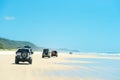 4wd vehicles at Rainbow Beach with coloured sand dunes, QLD, Australia Royalty Free Stock Photo