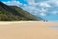 4wd vehicles at Rainbow Beach with coloured sand dunes, QLD, Australia Royalty Free Stock Photo