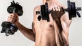 Weak man lift a weight, dumbbells, biceps, muscle, fitness. Man holding dumbbell in hand. Skinny guy hold dumbbells up