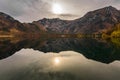 weak sun in a colorful autumn landscape on a mountain lake Royalty Free Stock Photo