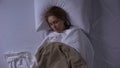 Weak woman sleeping at hospital ward, hospitalization, health care, top-view