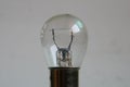 Weak yellow bulb light. small bulb black and white background Royalty Free Stock Photo