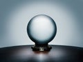 See your future in the magical crystal ball on simple dark wood table Royalty Free Stock Photo