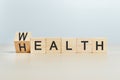 Wealth and health concept, word wealth to health on wooden cube blocks. growth investment future value success