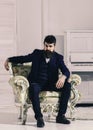 Wealth and richness concept. Man with beard and mustache wearing classic suit, stylish fashionable outfit. Macho Royalty Free Stock Photo