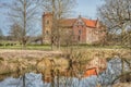 Wealthy countryside manor or estate Torups Slott captured through bare trees conveys a concept of ancient earldom or viscountcy