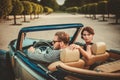Wealthy couple in classic convertible Royalty Free Stock Photo