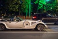 A wealthy elderly woman driving a stylish expensive convertible on the streets of an American city. USA, Miami, 25 June 2022 Royalty Free Stock Photo