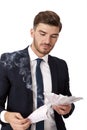 Wealthy successful businessman burning money Royalty Free Stock Photo