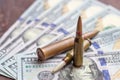 Weapon bullets on American dollars background. Military industry, war, global arms trade and crime concept Royalty Free Stock Photo