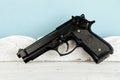 Weapon series. Modern U.S. Army handgun close-up on vintage wooden table. Royalty Free Stock Photo