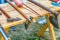 Weapons collection of medieval warrior battle ax, arrows on a wooden table Royalty Free Stock Photo