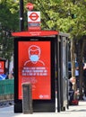 Wear A Face Mask sign on Oxford Street  London Royalty Free Stock Photo