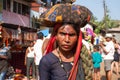A woman pilgrim carries a bundle with things on her head. Celebration of Maha Shivaratri. India, Karnataka, Gokarna. February, 201