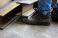 Wear safety shoes to ensure safety at work. construction workers wear safety shoes.