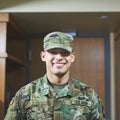 Wear your confidence like armor. a young soldier standing in the dorms of a military academy.