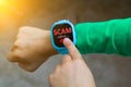Wearable kids smart watch receive unwanted scam call and track location with touch screen and voice service and boys hand try to