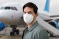 Wearing FFP2 Facemask In Airport. Plane Travel