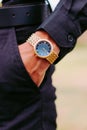 Wearing Gold and Silver Round Analog Watch