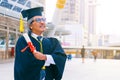 He is wearing graduate is dress and standing and show hand. Royalty Free Stock Photo