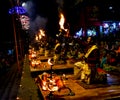 Some Brahman priest wearing red and yellow dress doing traditional ganga aarti at dasaswamedh ghat, Varanasi, Uttar Pradesh, India