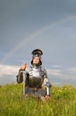 Weary knight, after the battle / rain and rainbow Royalty Free Stock Photo