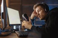 Weary man having job with gadgets Royalty Free Stock Photo