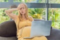 Weary pregnant woman, tired of working from home, navigates the challenges of balancing professional tasks with Royalty Free Stock Photo