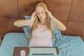 Weary pregnant woman, tired of working from home, navigates the challenges of balancing professional tasks with Royalty Free Stock Photo