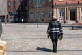 A weary traffic warden walks his area in the City of Liverpool on a hot day