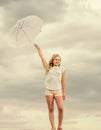 Weather changing. Fresh air. Girl with umbrella cloudy sky background. Freedom and freshness. Anti gravity concept