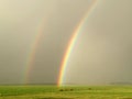 Weather Double Rainbow rain over green field rural farm landscape