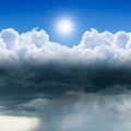 Weather forecast concept image: variety weather conditions, bright sun in blue sky, dark clouds with heavy rain Royalty Free Stock Photo
