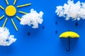 Weather forecast concept. Sunny and rainy. blue background top view copy space Royalty Free Stock Photo