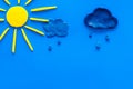 Weather forecast concept. Sunny and rainy. blue background top view space for text Royalty Free Stock Photo