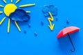 Weather forecast concept. Sunny and rainy. blue background top view copy space Royalty Free Stock Photo